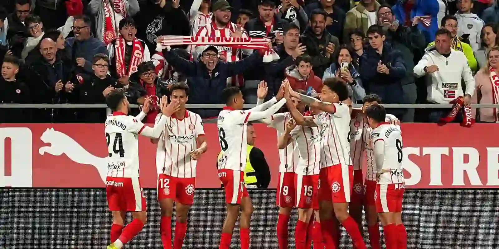 Girona players celebrate after opening the score against Villarreal