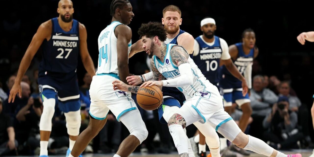 LaMelo Ball dribbles the ball
