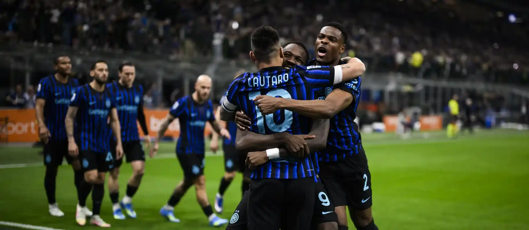 Inter players celebrate after scoring against Roma