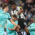 Juventus and Bologna players in a battle for a high ball