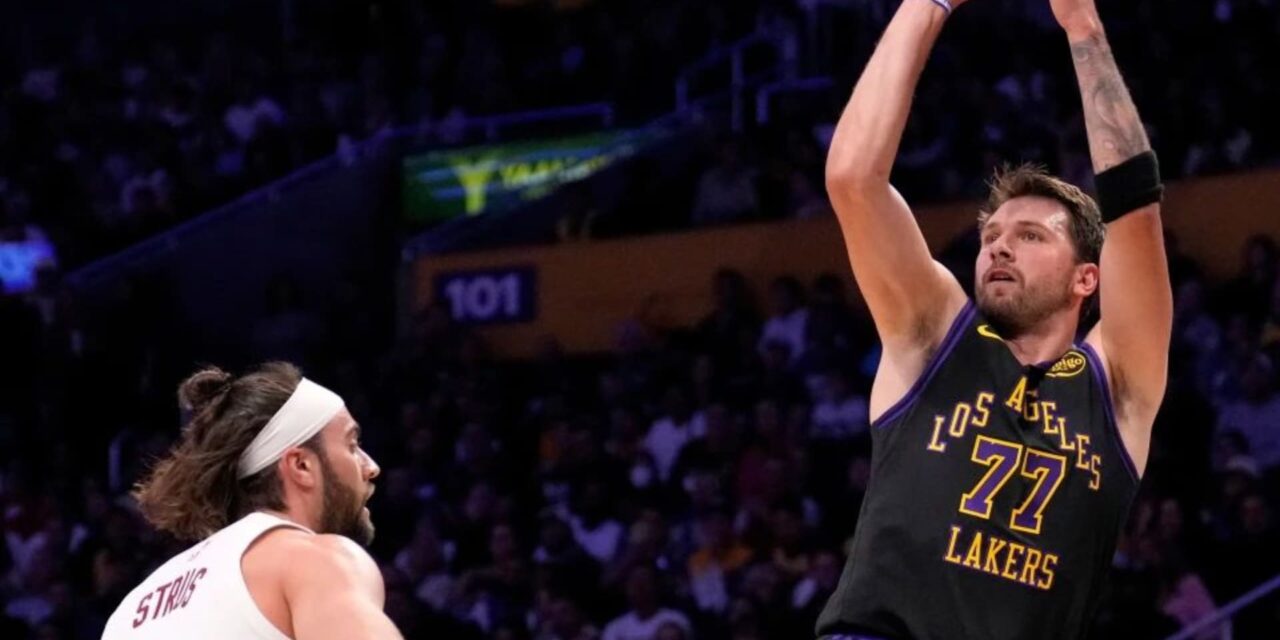 Luka Doncic shooting over Max Struss