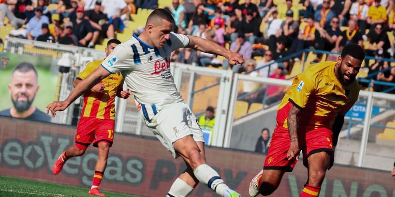 Atalanta player shooting towards Lecce's goal