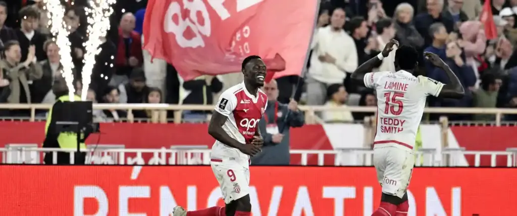 Monaco players celebrate after scoring against Marseille