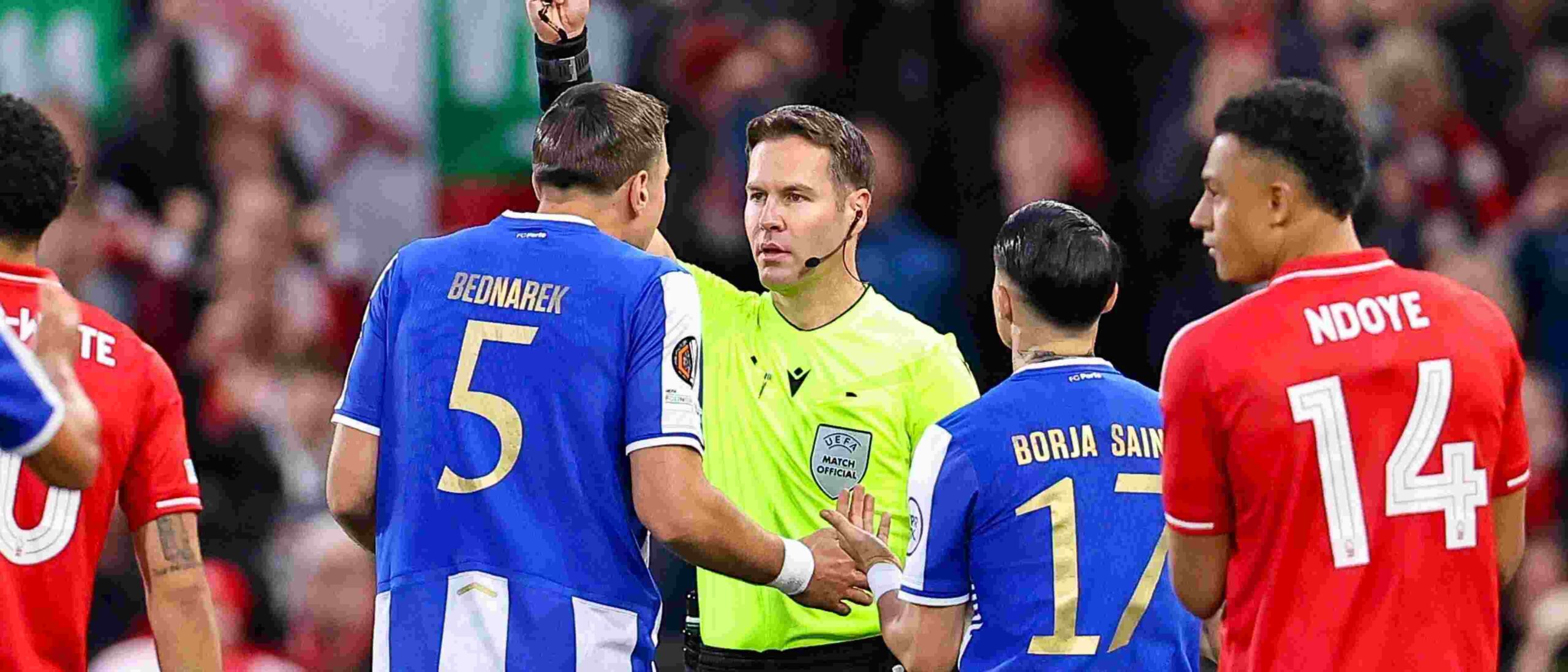 Referee showing Jan Bednarek a red card