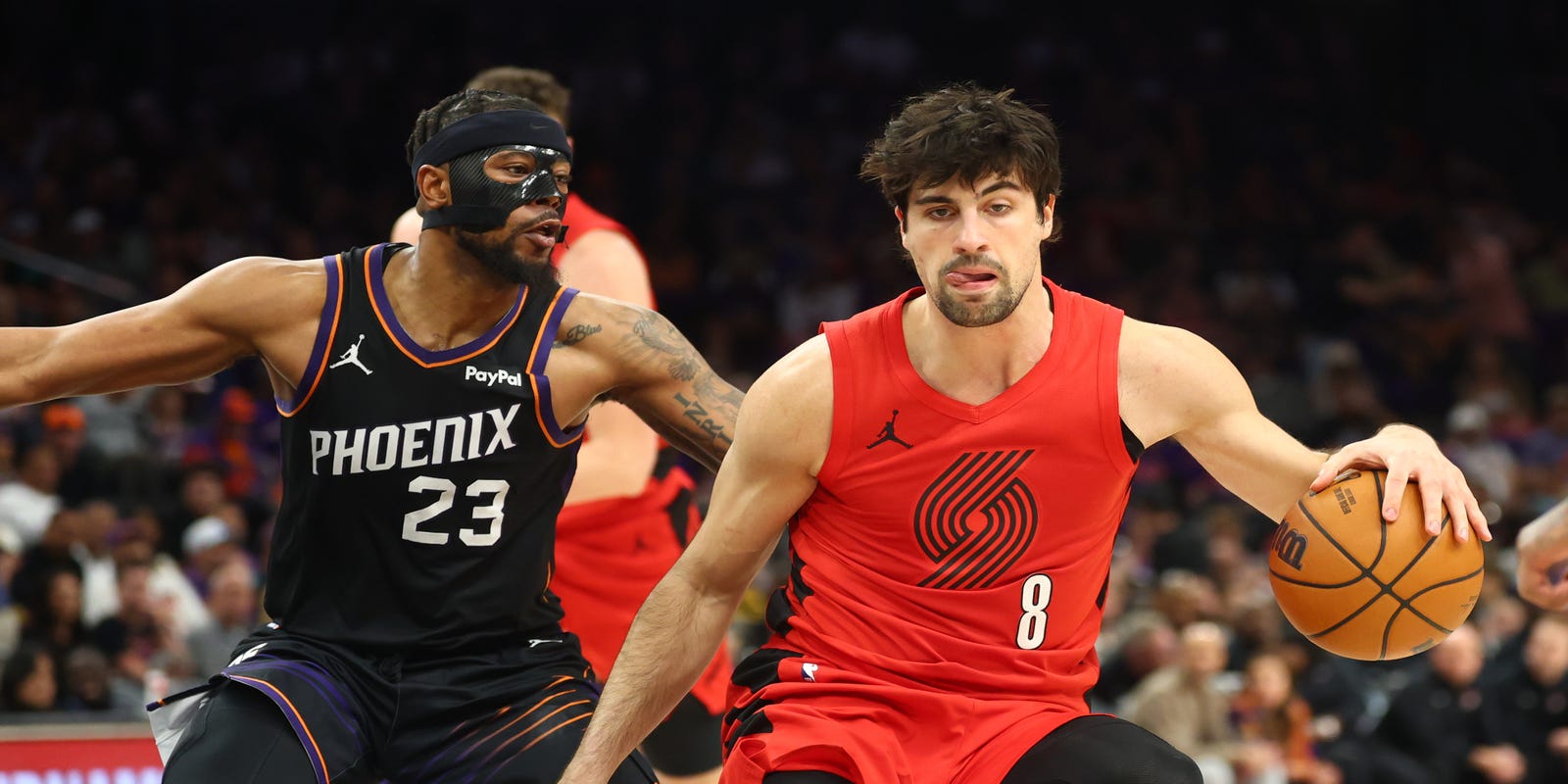 Deni Avdija guarded by Jordan Goodwin