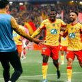Lens players celebrate after scoring against Toulouse