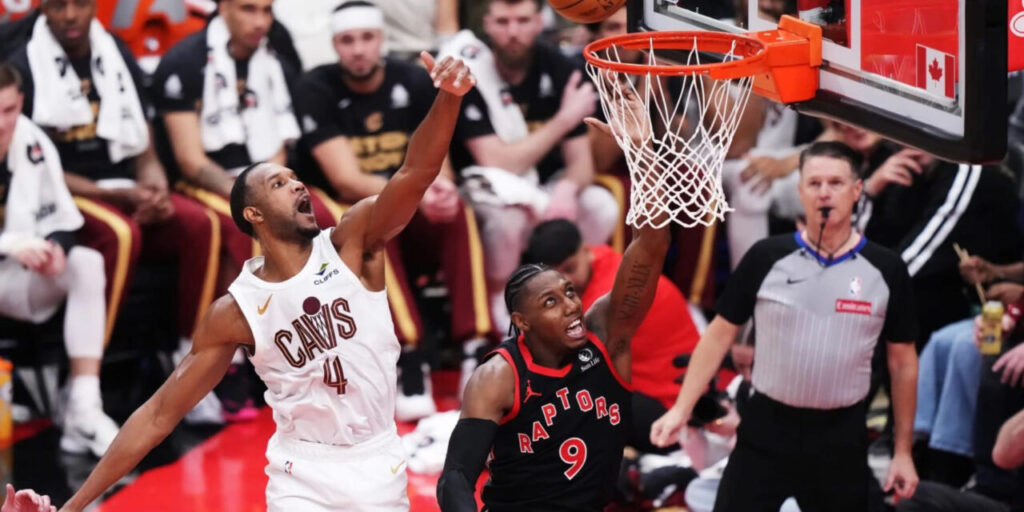 RJ Barrett dunking the ball in Cleveland Cavaliers' basket