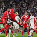 Dayot Upamecano heading the ball towards Real Madrid goal