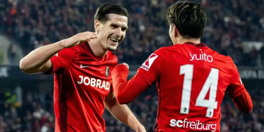 Freiburg players celebrate after scoring against Celta