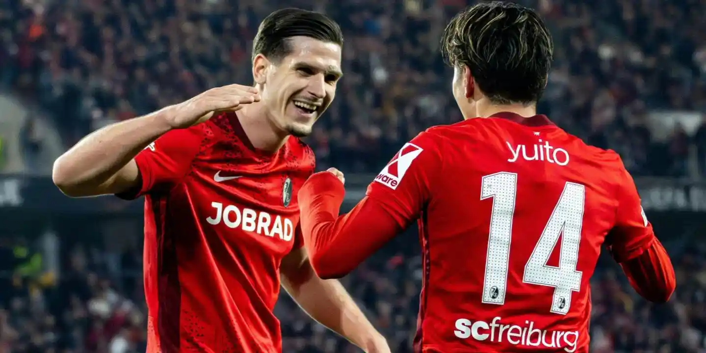 Freiburg players celebrate after scoring against Celta
