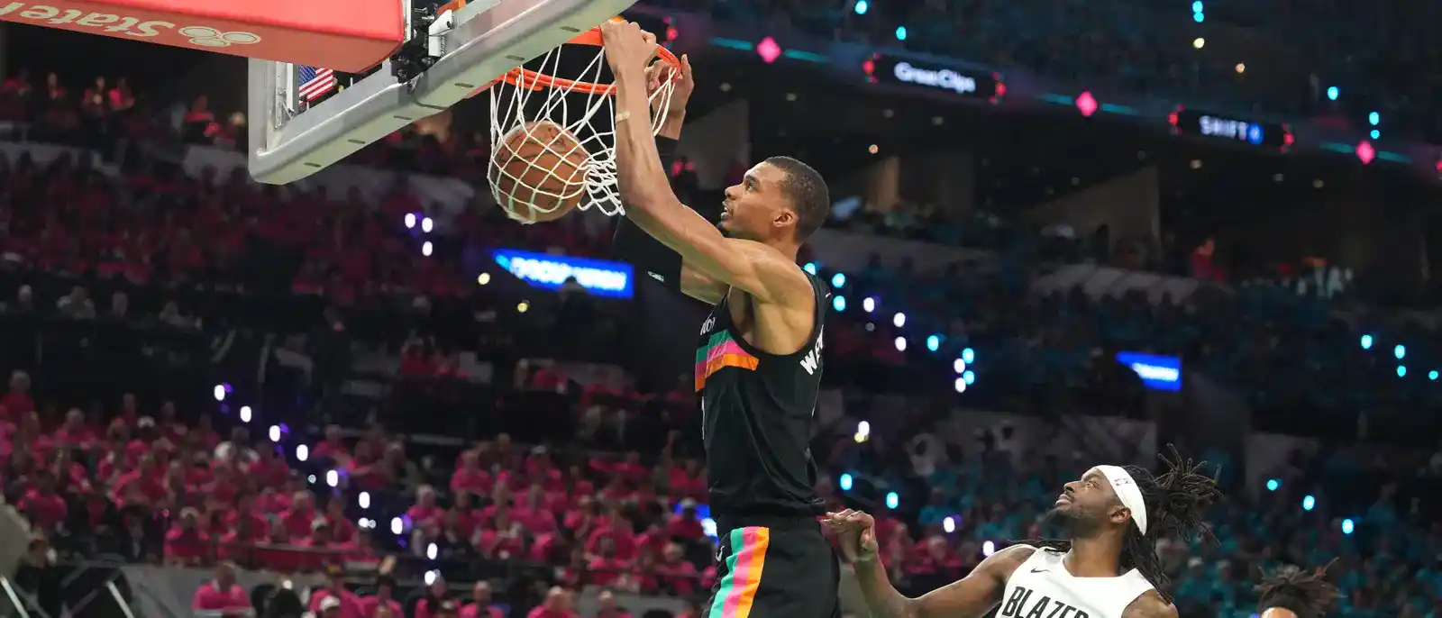 Victor Wembanyama dunking the ball in Portland Trail Blazers' basket