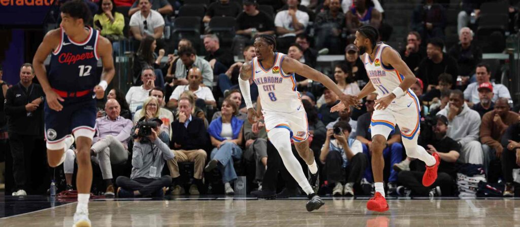 Oklahoma City Thunder players congratulating one another after scoring a basket against Los Angeles Clippers