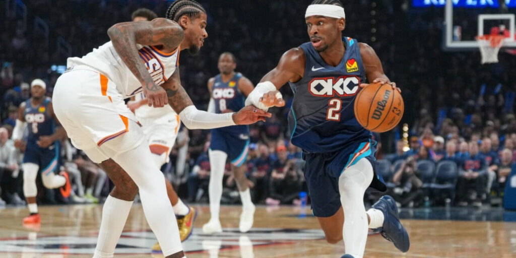 Shai Gilgeous-Alexander dribbling the ball, guarded by Jalen Green