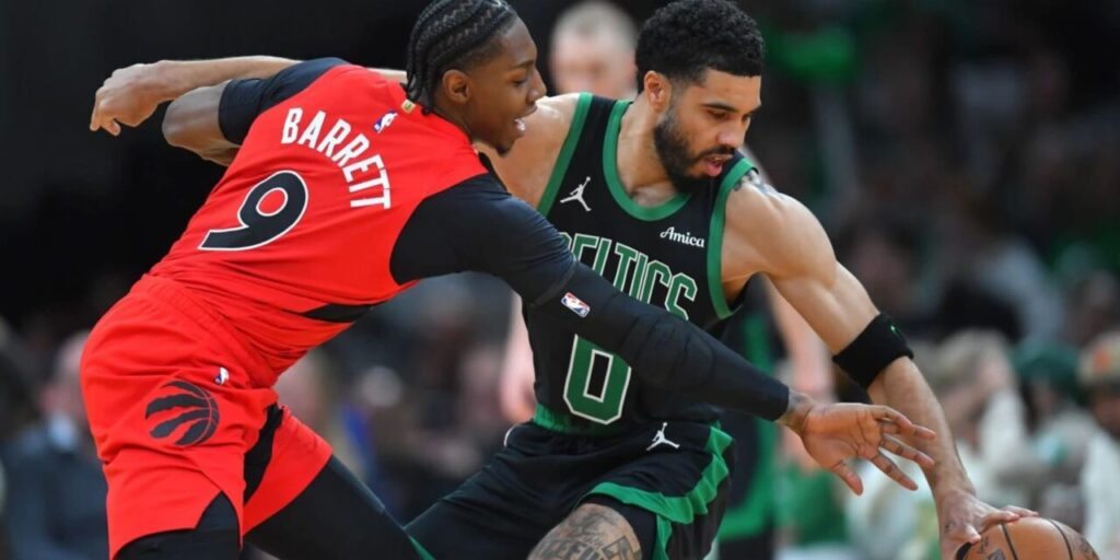 RJ Barrett trying to steal the ball from Jayson Tatum