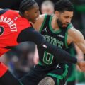 RJ Barrett trying to steal the ball from Jayson Tatum