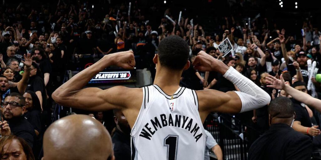 Victor Wembanyama flexing muscles