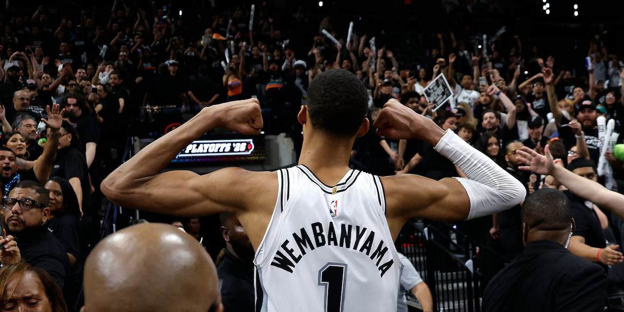 Victor Wembanyama flexing muscles