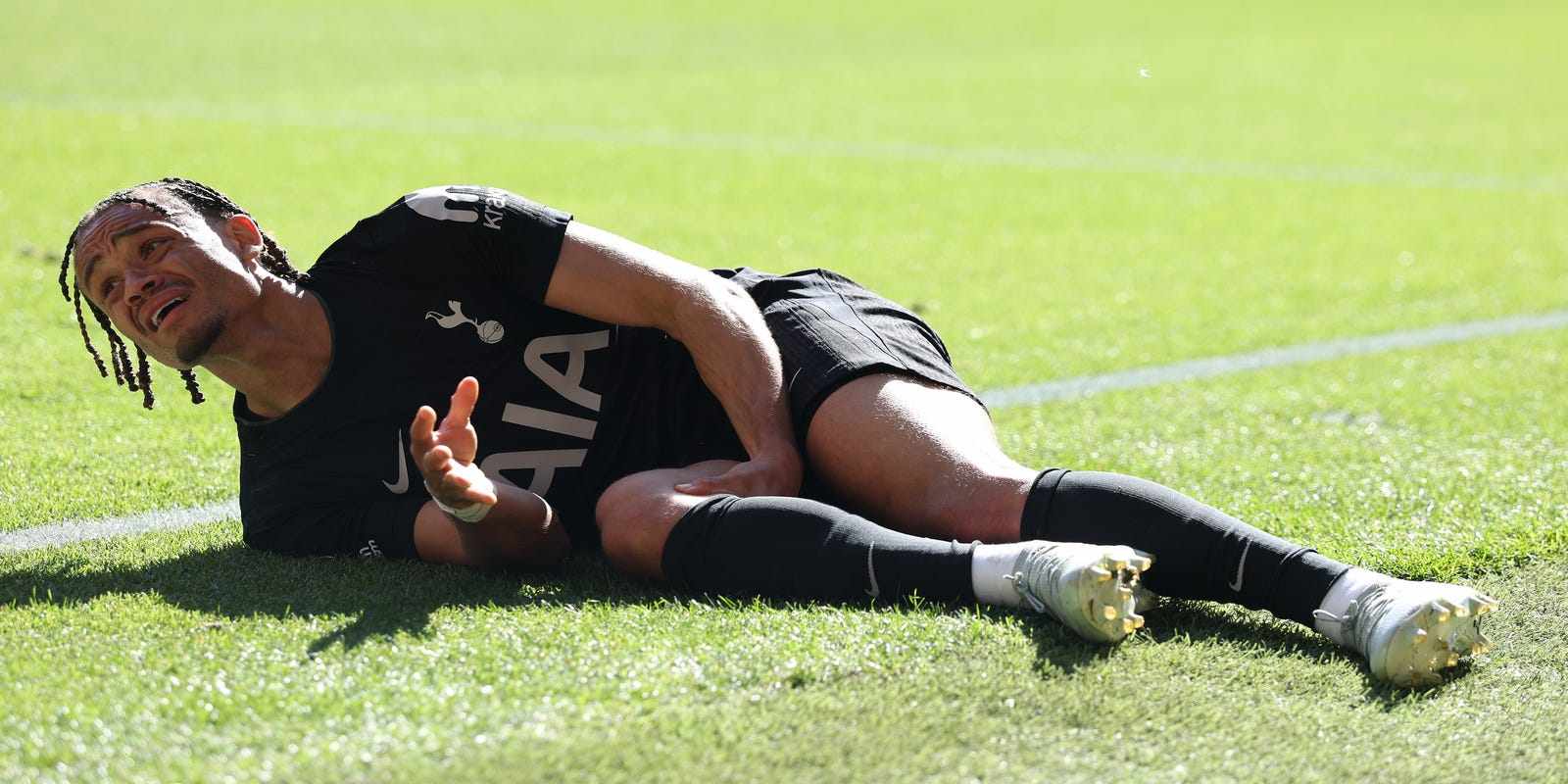 Xavi Simons lying on the ground with an injury