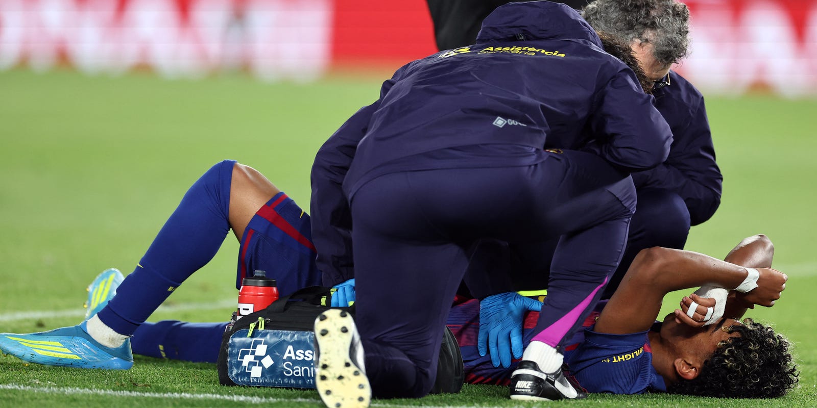 Lamine Yamal lying on the pitch with an injury