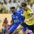Cristiano Ronaldo trying to dribble past Al Hilal player
