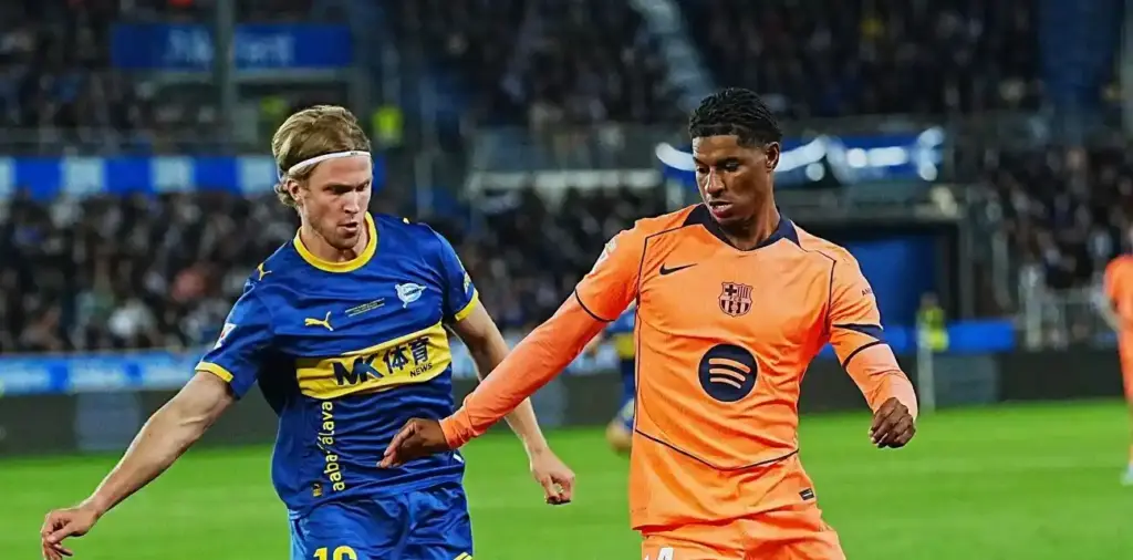 Alaves and Barcelona players in a battle for the ball