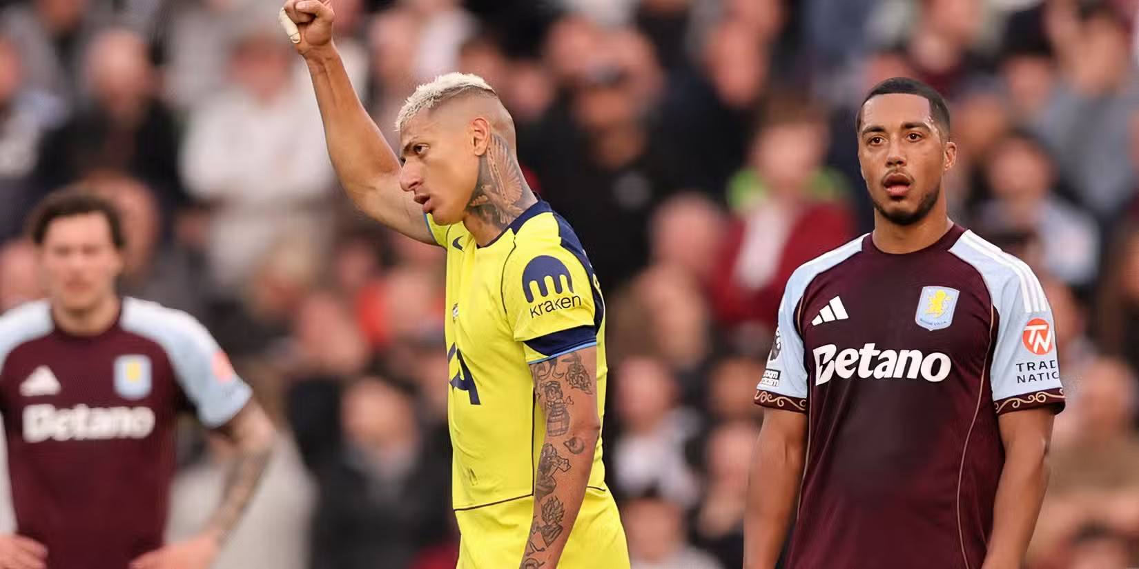 Richarlison holds his hand high after scoring for Tottenham against Aston Villa
