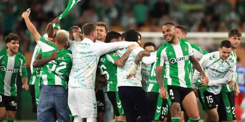 Betis players celebrate qualifying to the Champions League