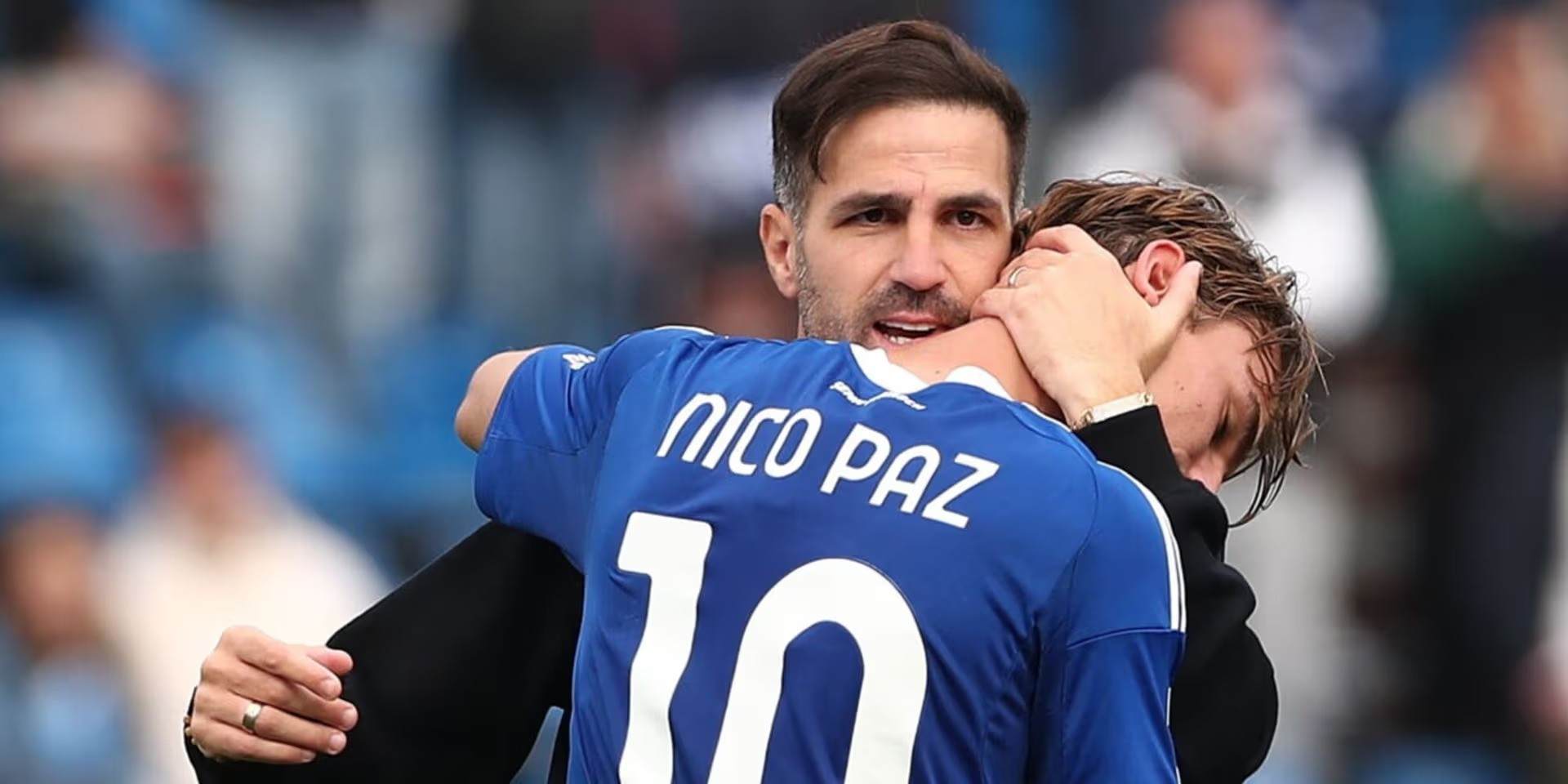 Cesc Fabregas hugging Nico Paz
