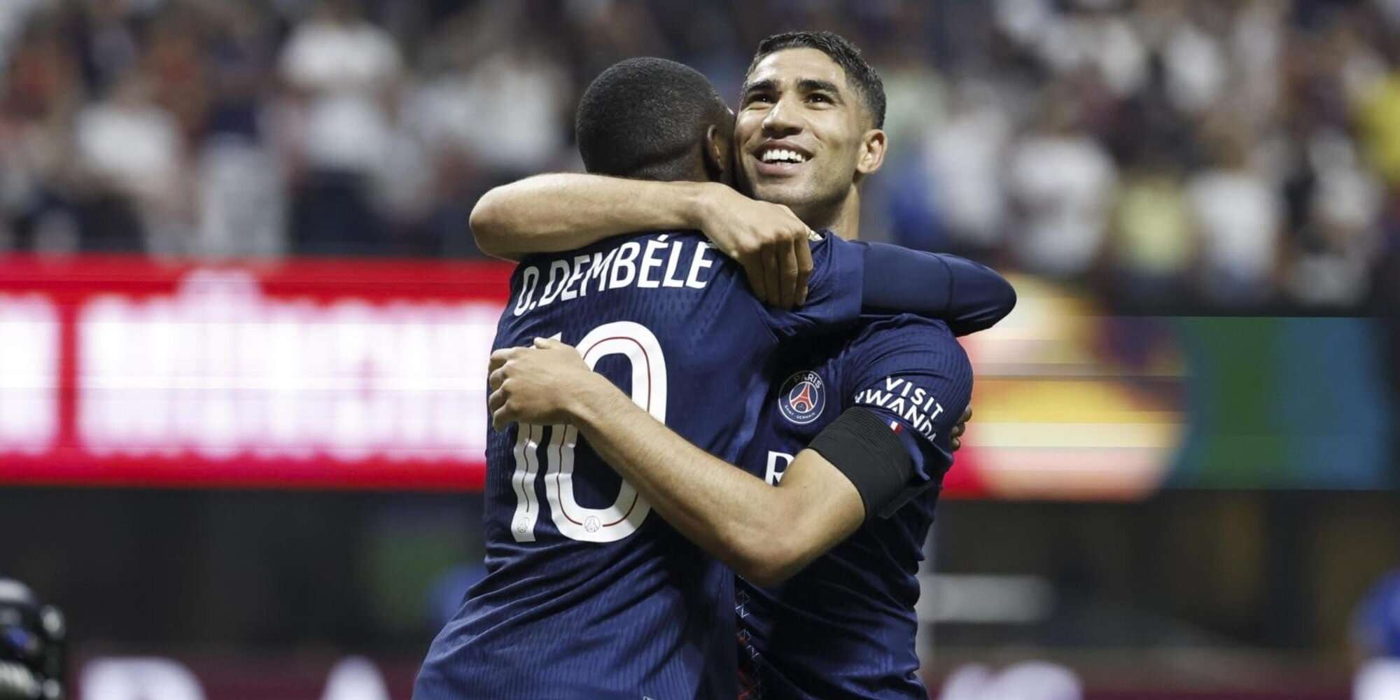 Achraf Hakimi and Ousmane Dembele hugging each other