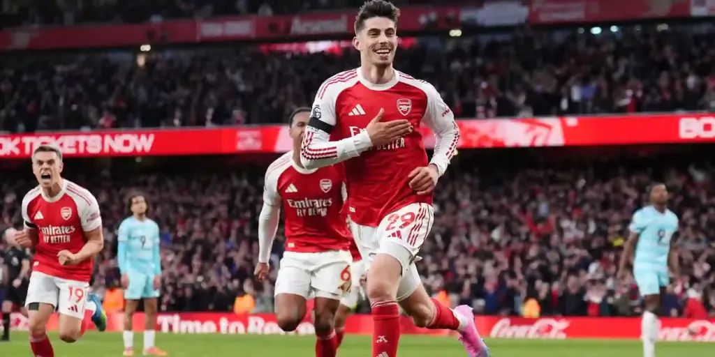 Arsenal players rush to celebrate after Kai Havertz has scored against Burnley
