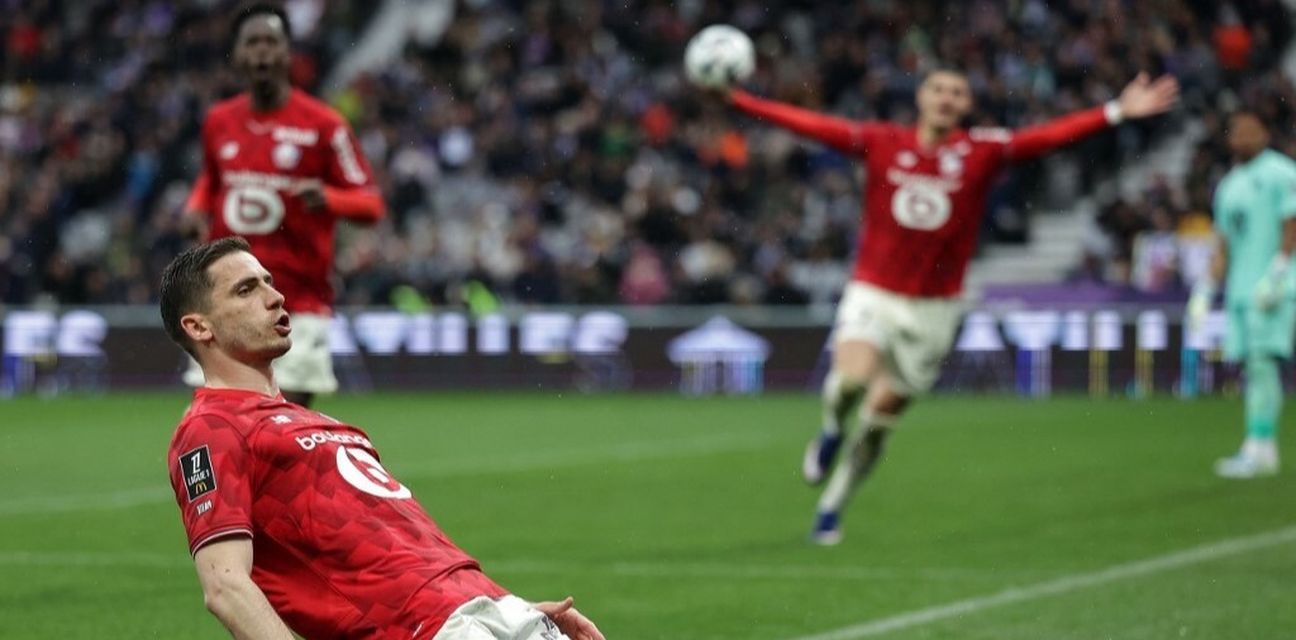 Lille players celebrate after scoring a goal