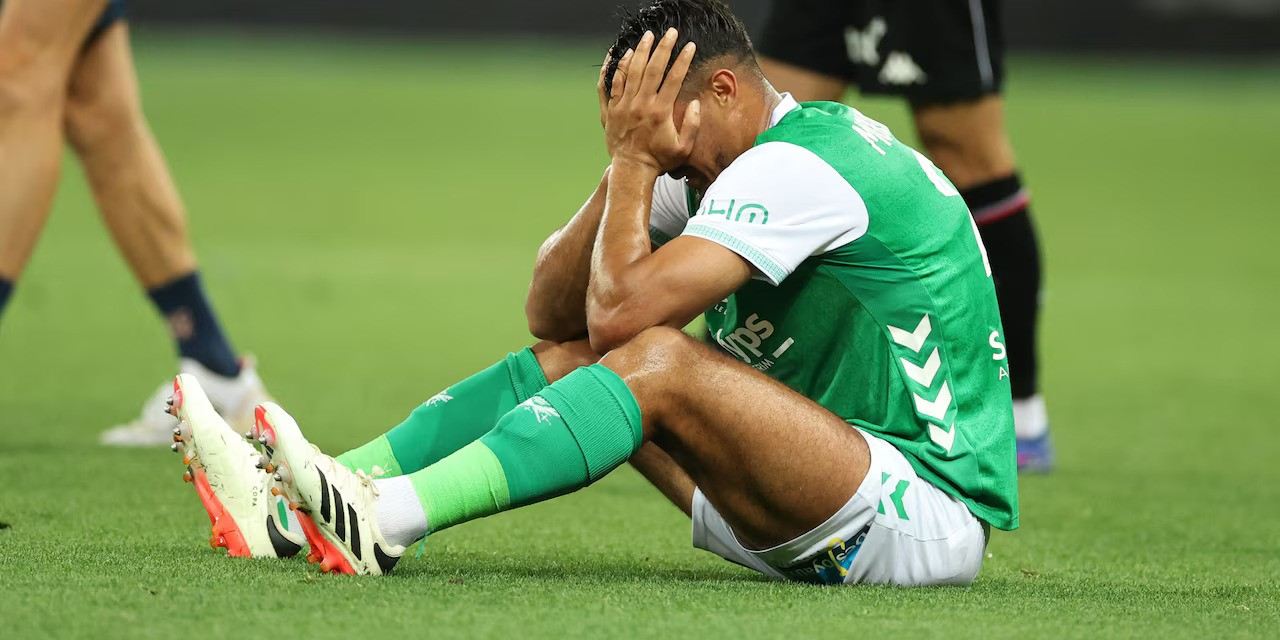 St Etienne player holding his head in disappointment after losing promotion play-off to Nice