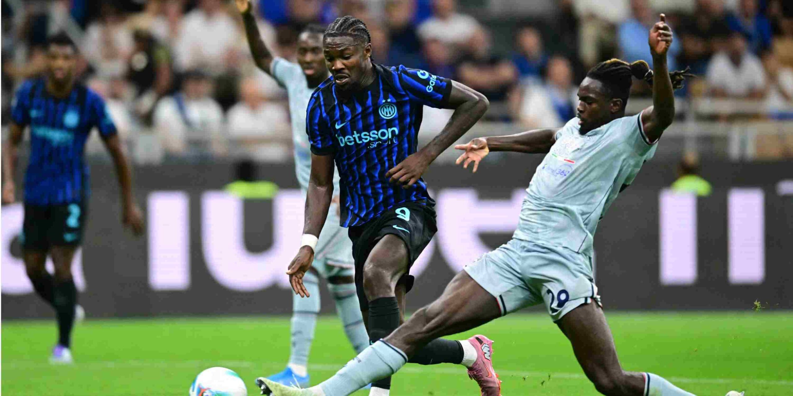 Oumar Solet tackling Marcus Thuram