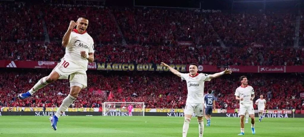 Sevilla players celebrate after scoring against Real Sociedad