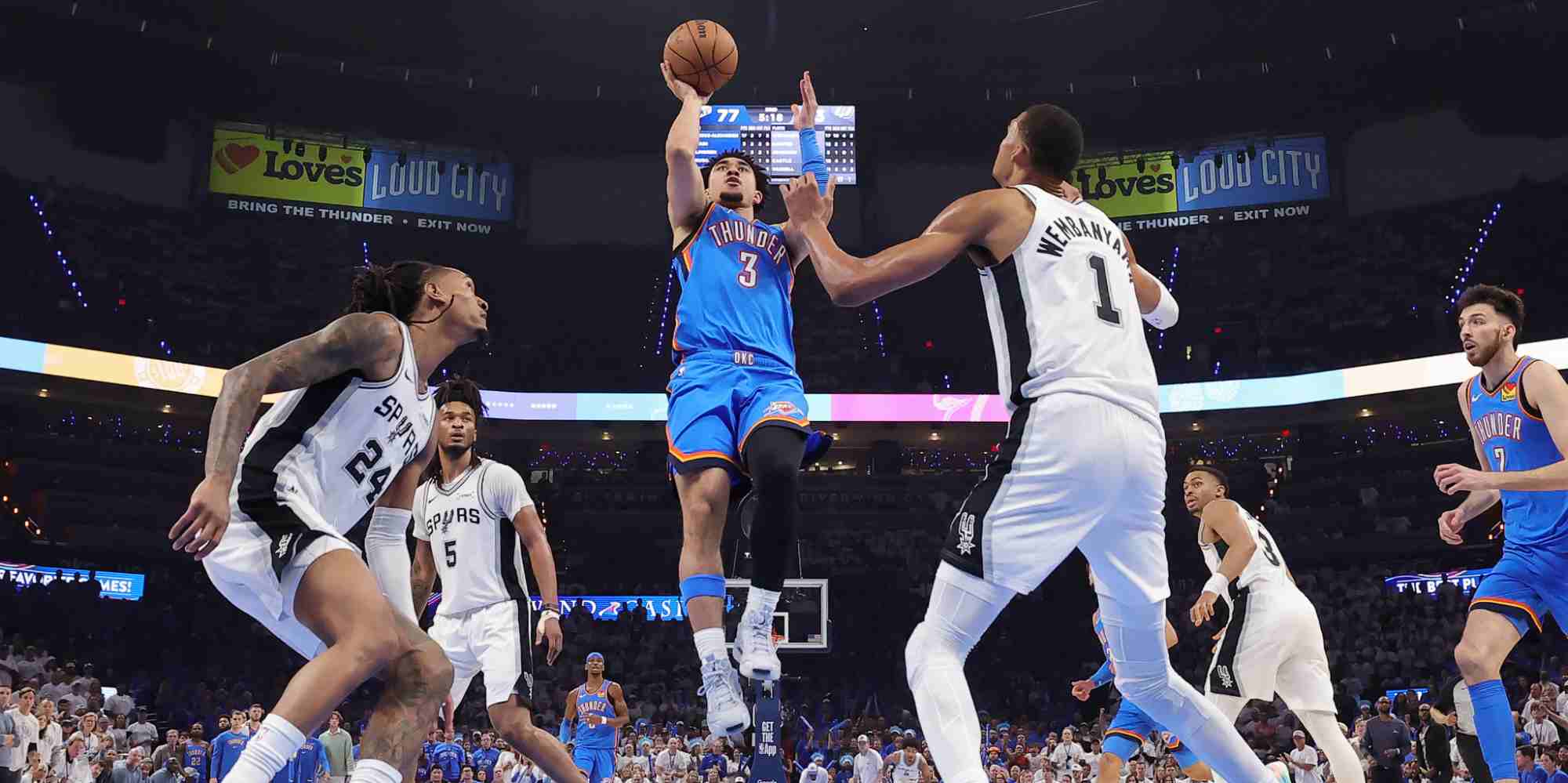 Jarred McCain attacking San Antonio Spurs' basket