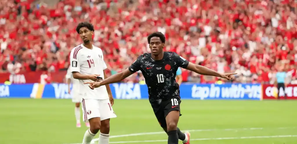 Jonathan David celebrates after scoring against Qatar