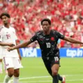 Jonathan David celebrates after scoring against Qatar
