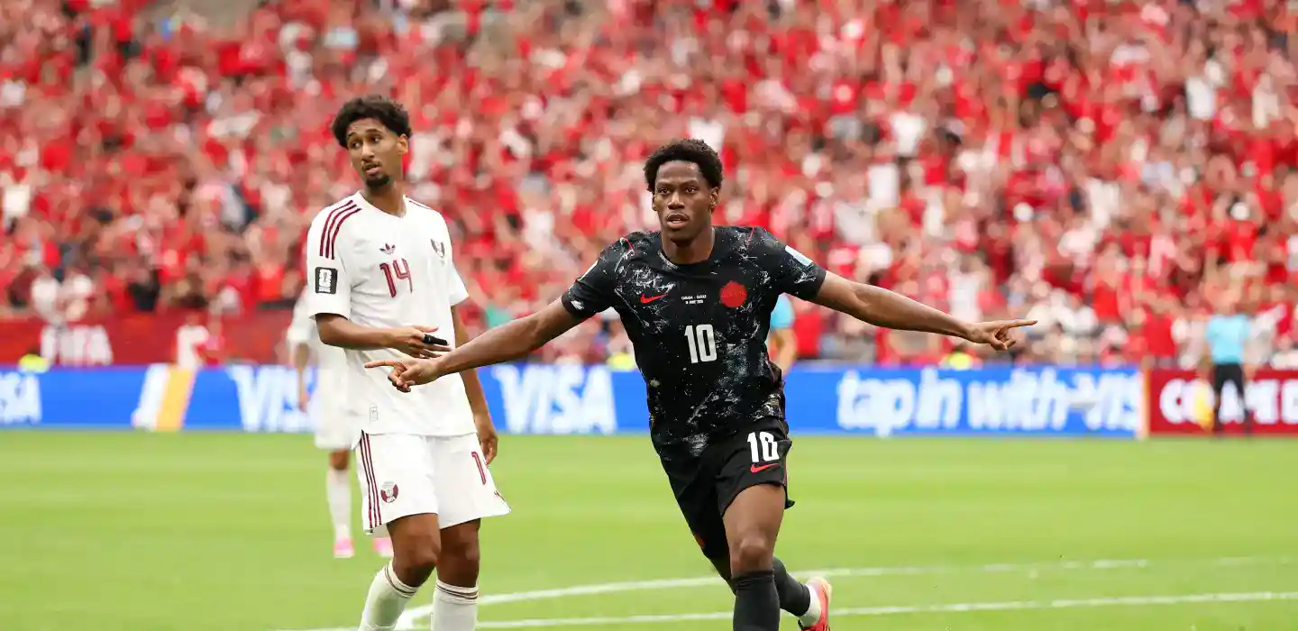 Jonathan David celebrates after scoring against Qatar