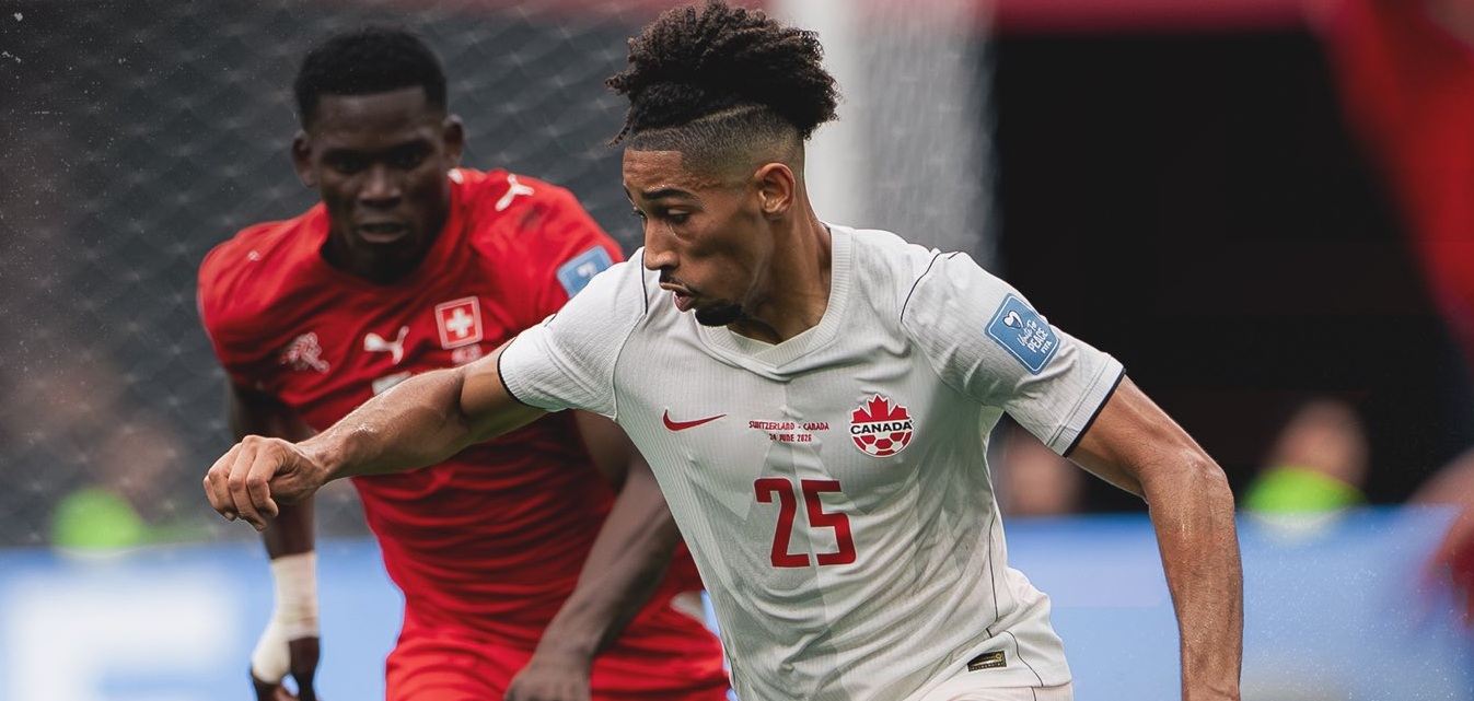 Canada and Switzerland players in a battle for the ball