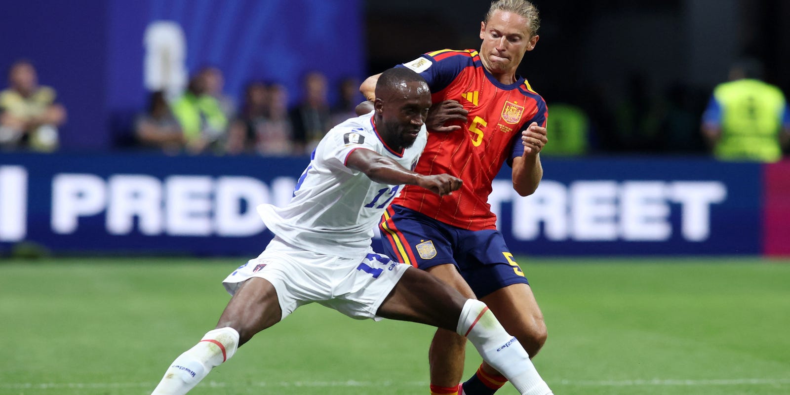 Cape Verde player guarding the ball from Marcos Llorente