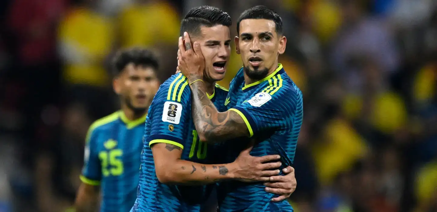 James Rodriguez and Daniel Munoz celebrate Colombia's opening goal against Uzbekistan