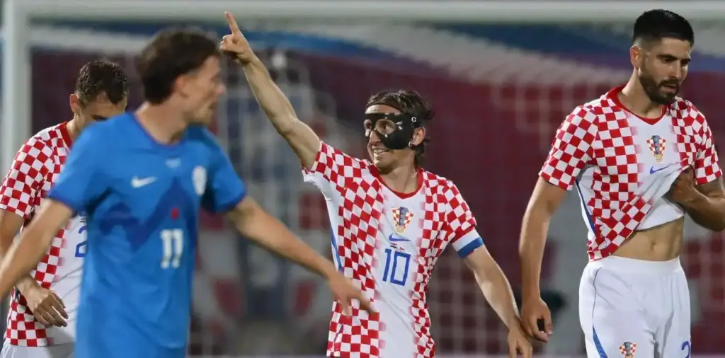Luka Modric celebrates after scoring against Slovenia in a friendly