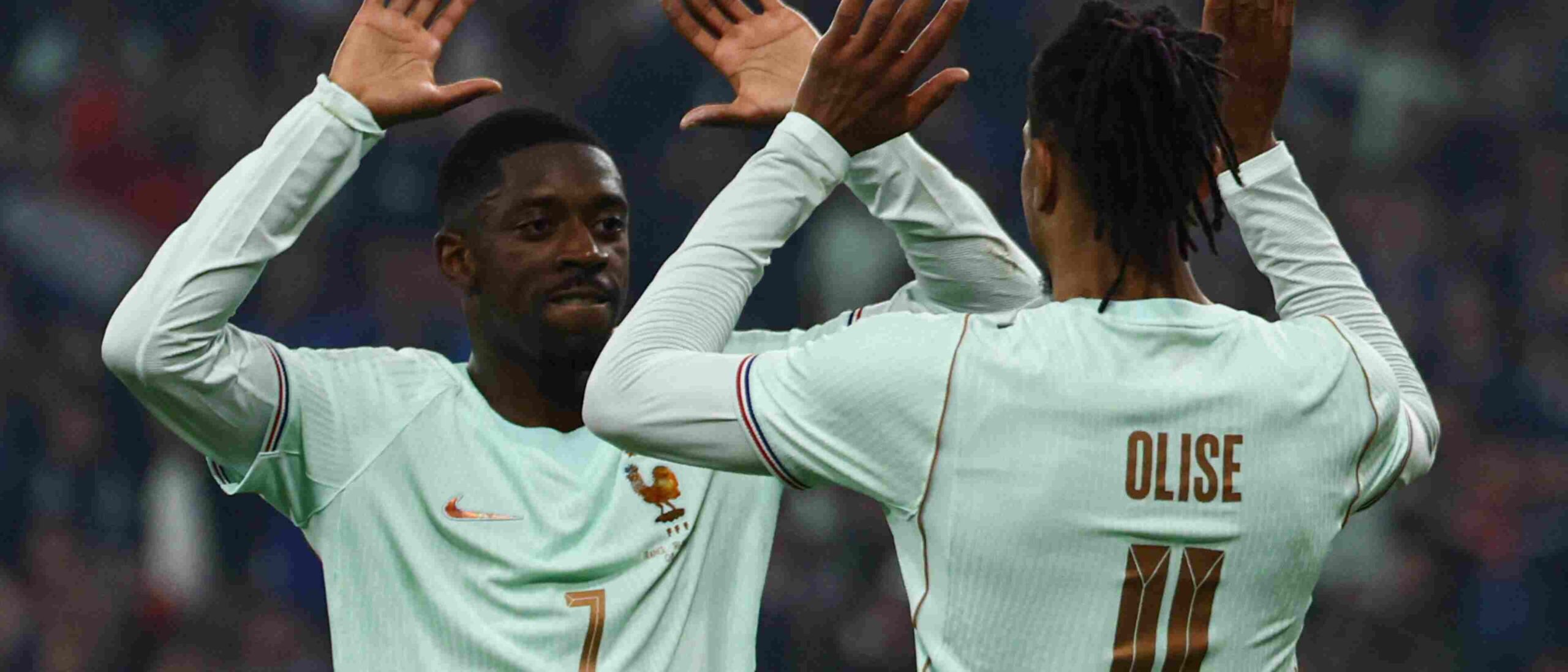 Ousmane Dembele and Michael Olise hi-fiving