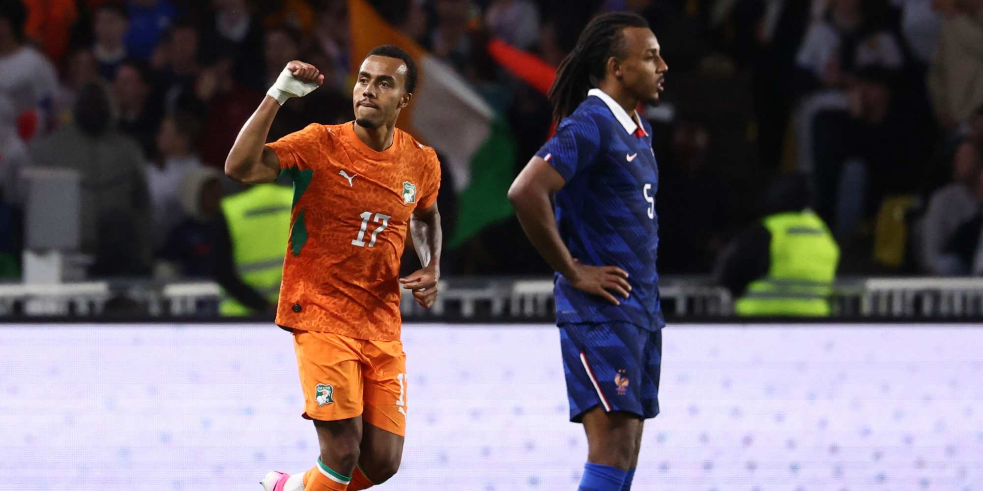 Guela Doue celebrates after scoring against France