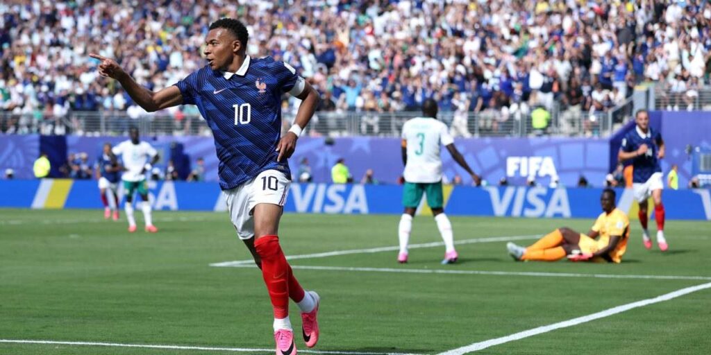 Kylian Mbappe celebrates after scoring against Senegal
