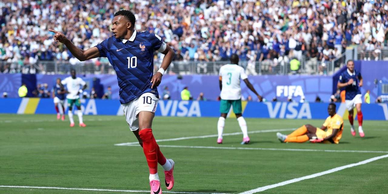 Kylian Mbappe celebrates after scoring against Senegal