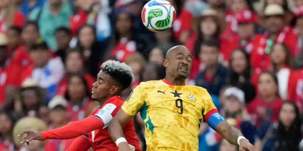 Ghana and Panama players in a battle for a high ball
