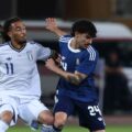 Greece and Italy players in a battle for the ball