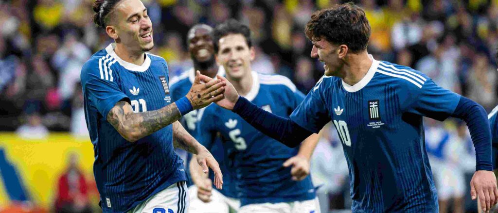 Greece players celebrate after scoring against Sweden