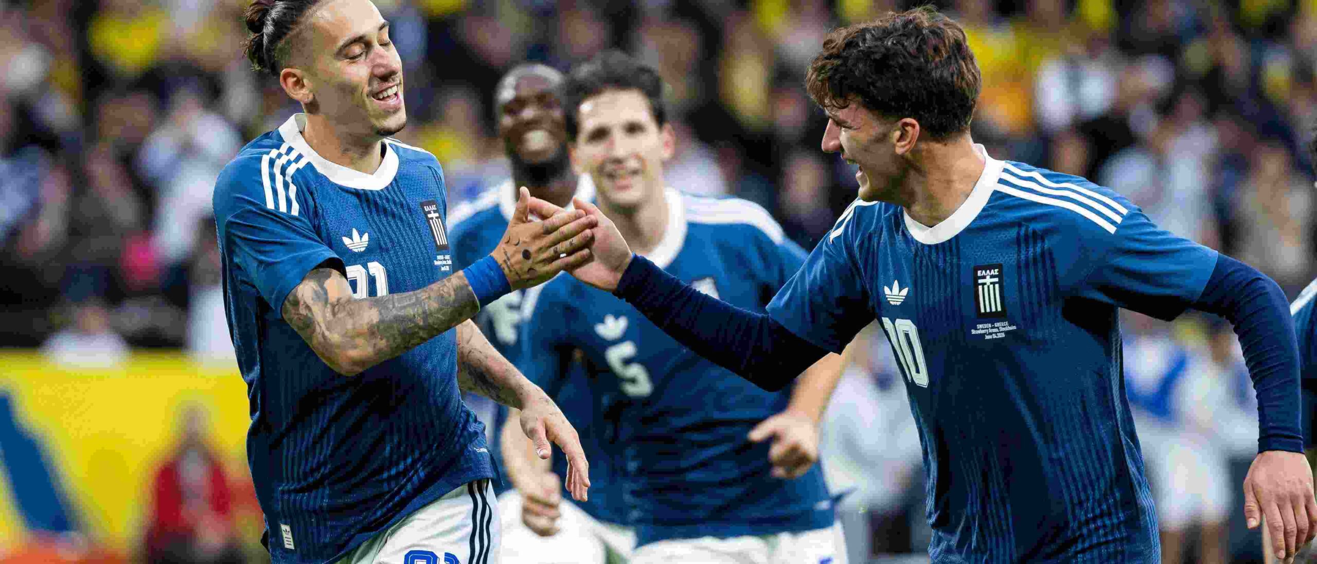Greece players celebrate after scoring against Sweden